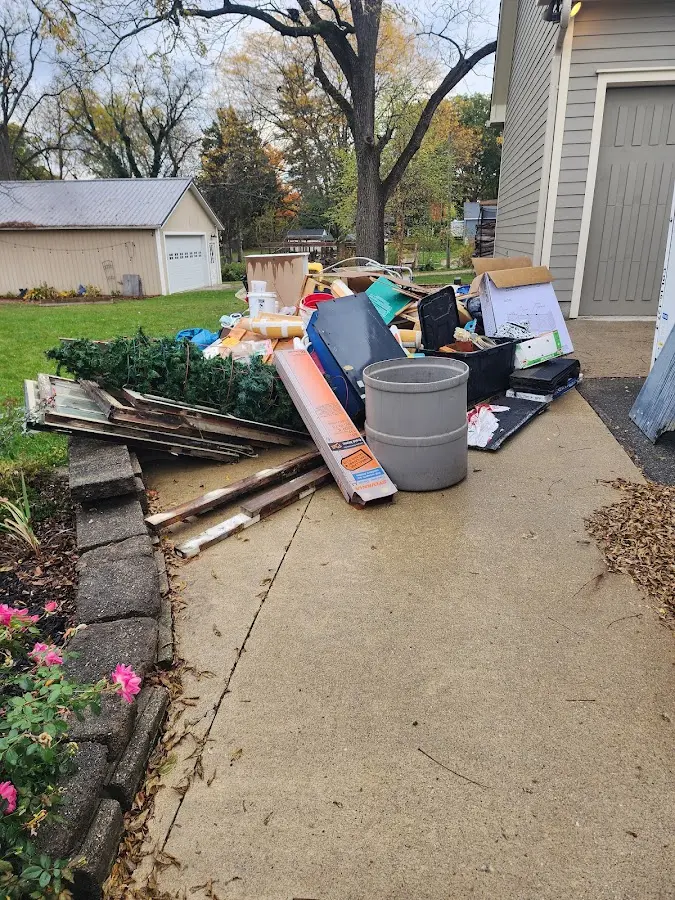 Dumpster being loaded with debris for 10 Yard Dumpster Rental in Clarksburg